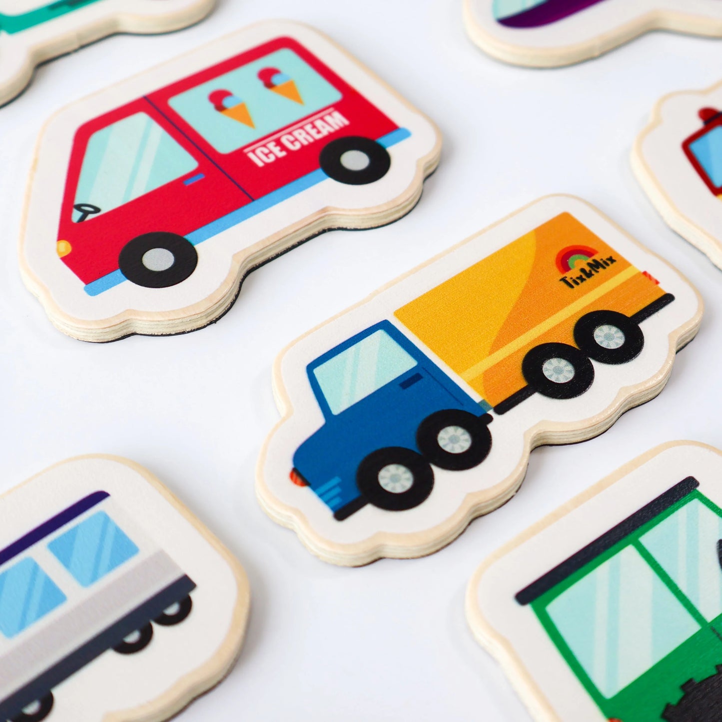 A closeup photo of Tix&Mix wooden magnetic vehicles playset.
