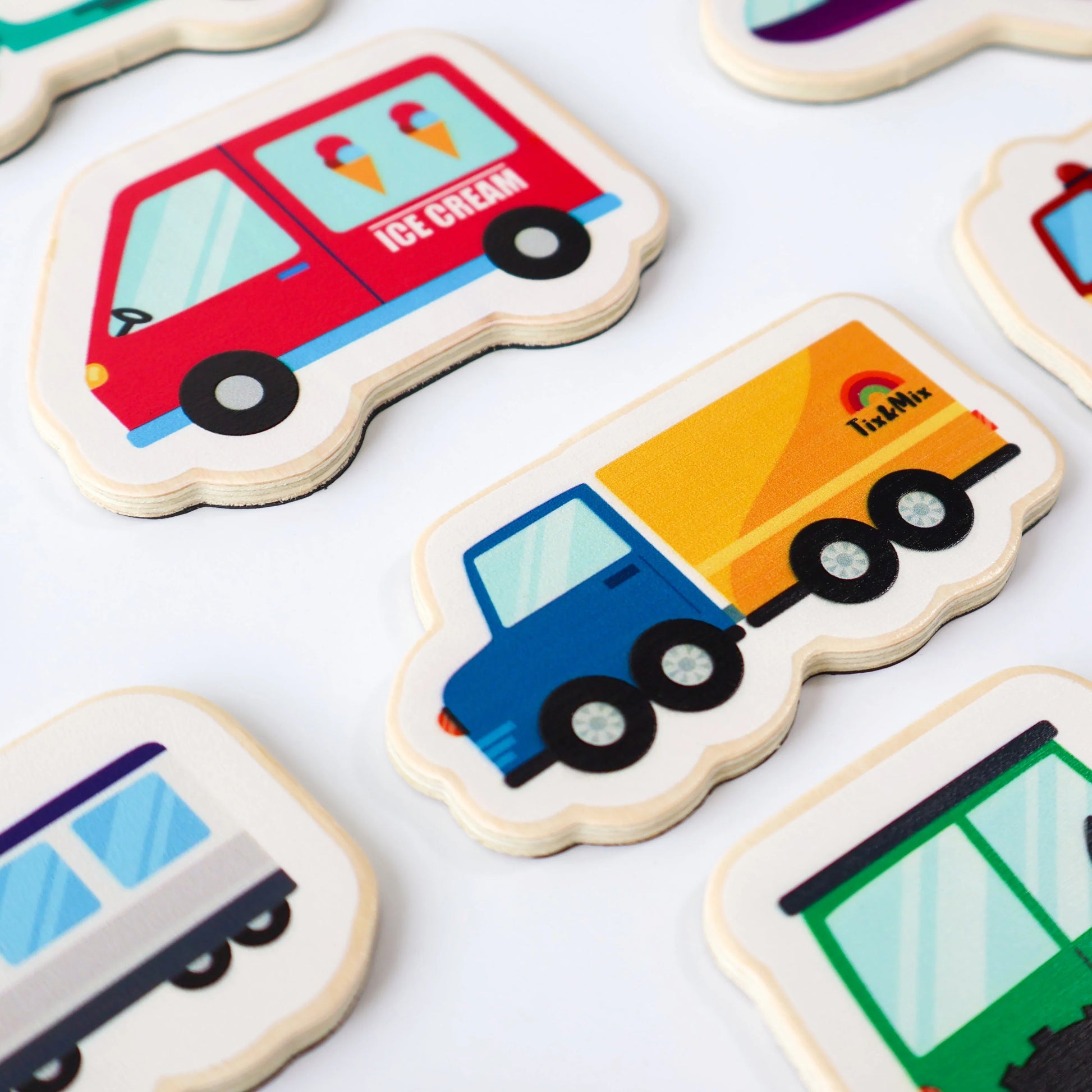 A closeup photo of Tix&Mix wooden magnetic vehicles playset.